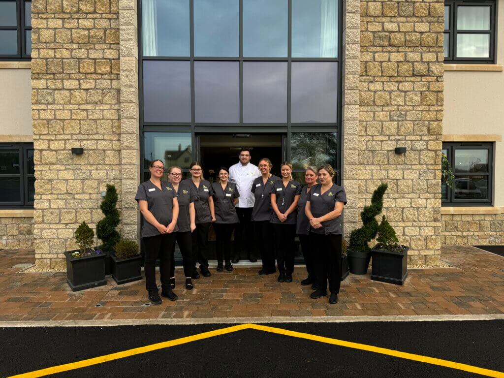 Somer Valley House Team outside the front of the care home