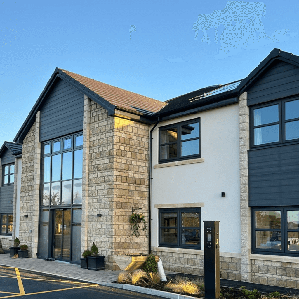 Front, outside view of Somer Valley House care home on a sunny day